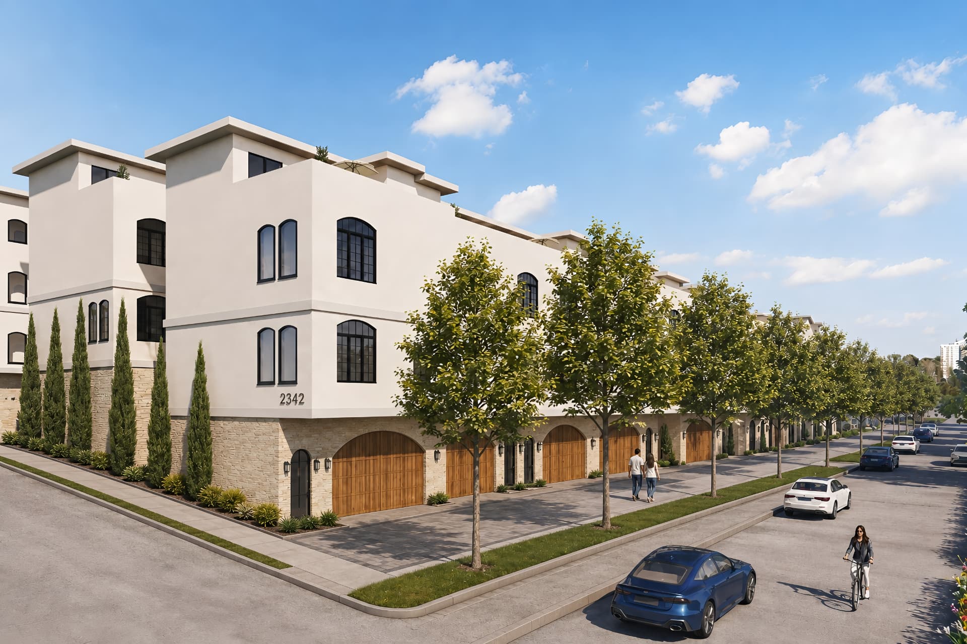Arroyo townhomes at 2342 with arched wood garage doors along a tree-lined street